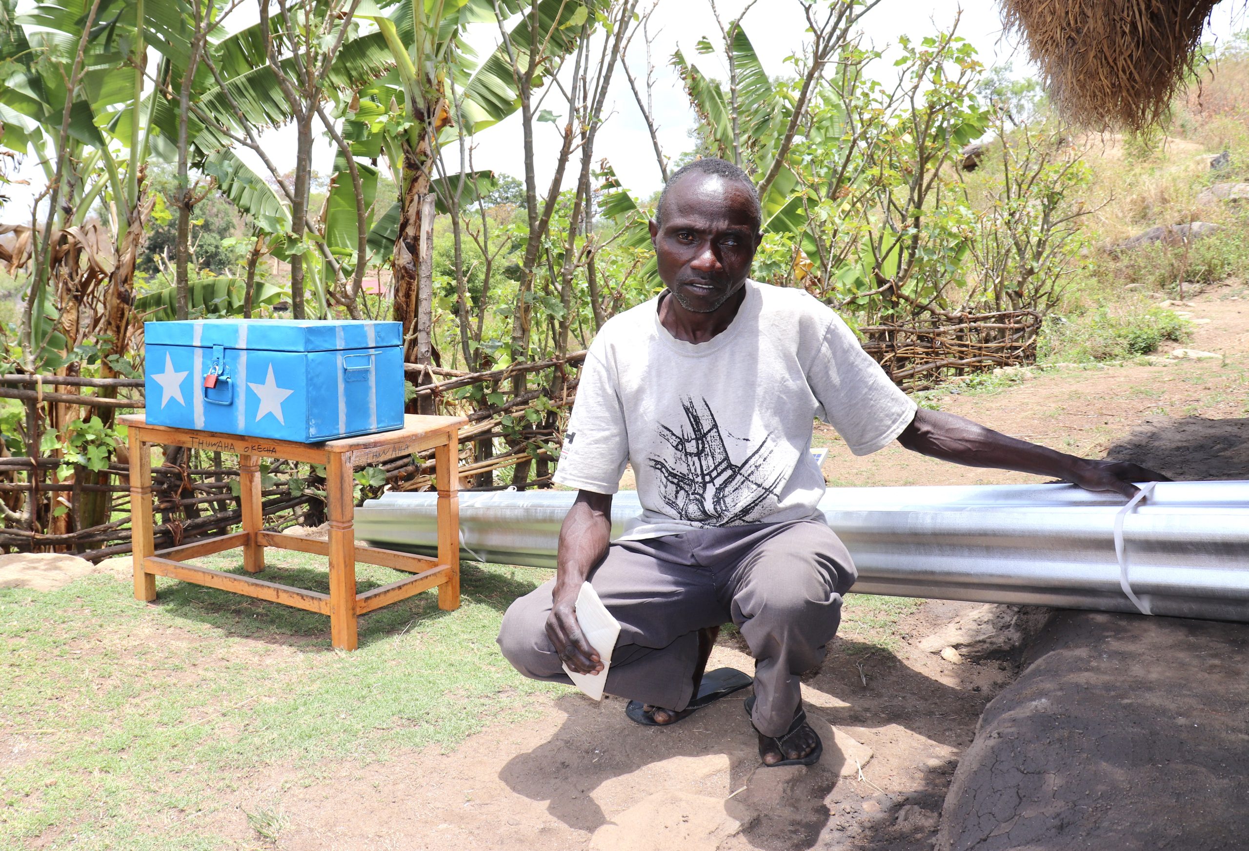 Profile 1 – Okecha has so far used part of his grant to buy iron sheets to build a new house